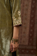 Dusty green silk velvet short kurta set with gold gota and zari embroidery.