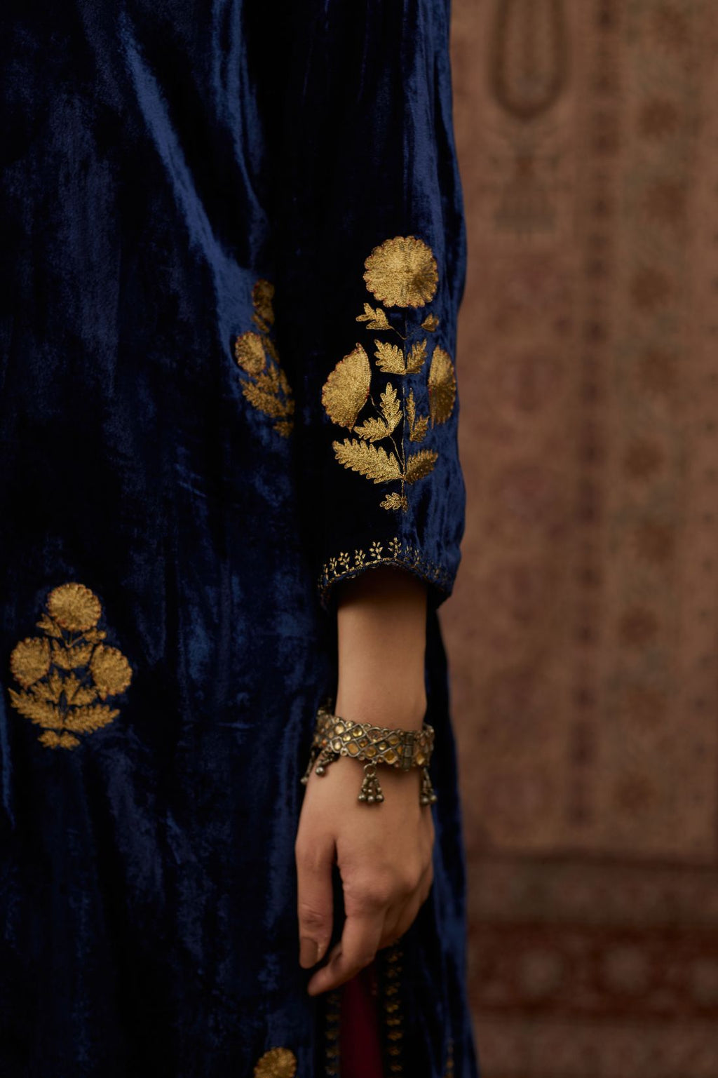 Navy blue silk velvet straight kurta set with all over gold zari embroidery butas.