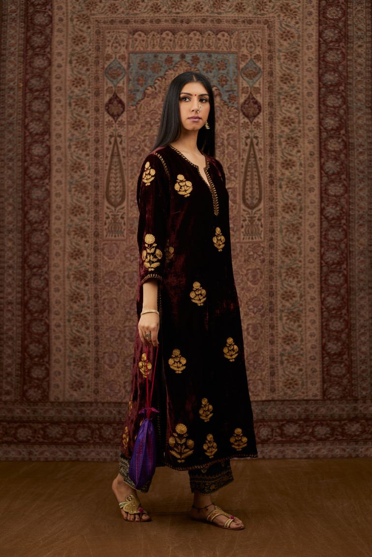 Maroon silk velvet straight kurta set with all over gold zari embroidery butas.