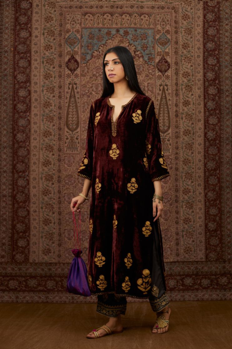 Maroon silk velvet straight kurta set with all over gold zari embroidery butas.