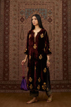 Maroon silk velvet straight kurta set with all over gold zari embroidery butas.