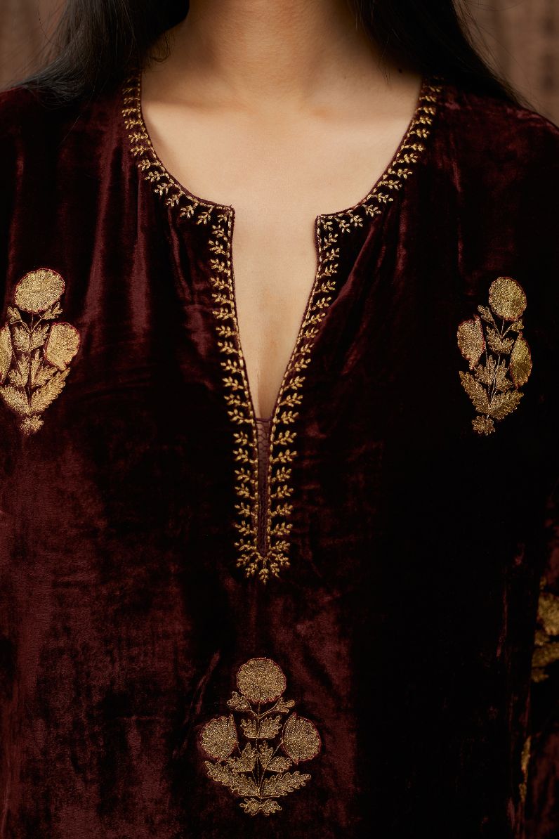 Maroon silk velvet straight kurta set with all over gold zari embroidery butas.