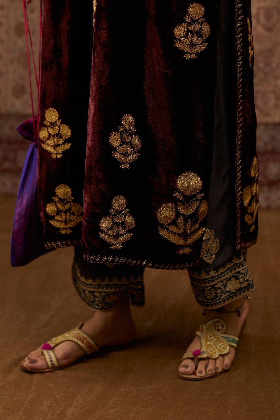 Maroon silk velvet straight kurta set with all over gold zari embroidery butas.