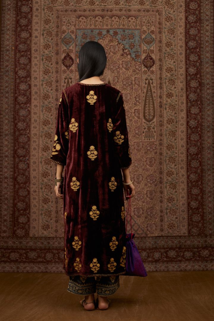 Maroon silk velvet straight kurta set with all over gold zari embroidery butas.