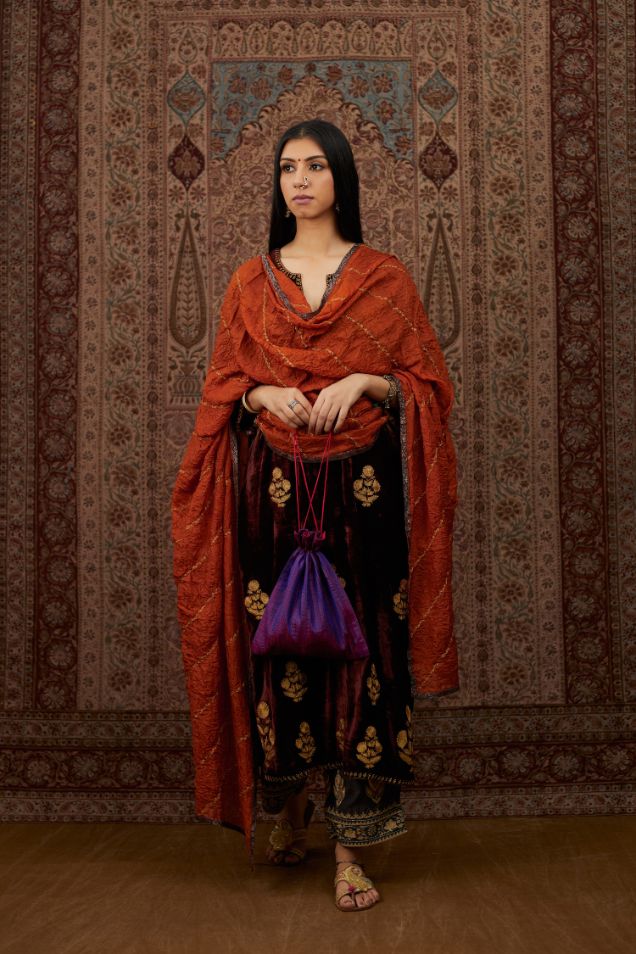 Maroon silk velvet straight kurta set with all over gold zari embroidery butas.