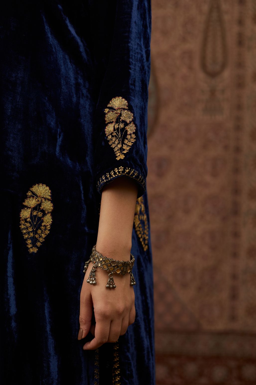 Navy blue silk velvet straight kurta set with all over gold zari embroidery butas and round neckline.
