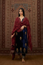 Navy blue silk velvet straight kurta set with all over gold zari embroidery butas and round neckline.
