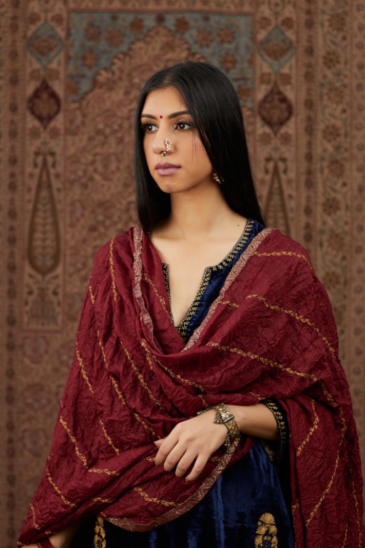 Navy blue silk velvet straight kurta set with all over gold zari embroidery butas and round neckline.
