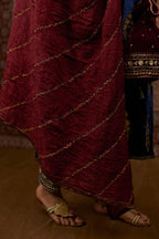 Navy blue silk velvet straight kurta set with all over gold zari embroidery butas and round neckline.