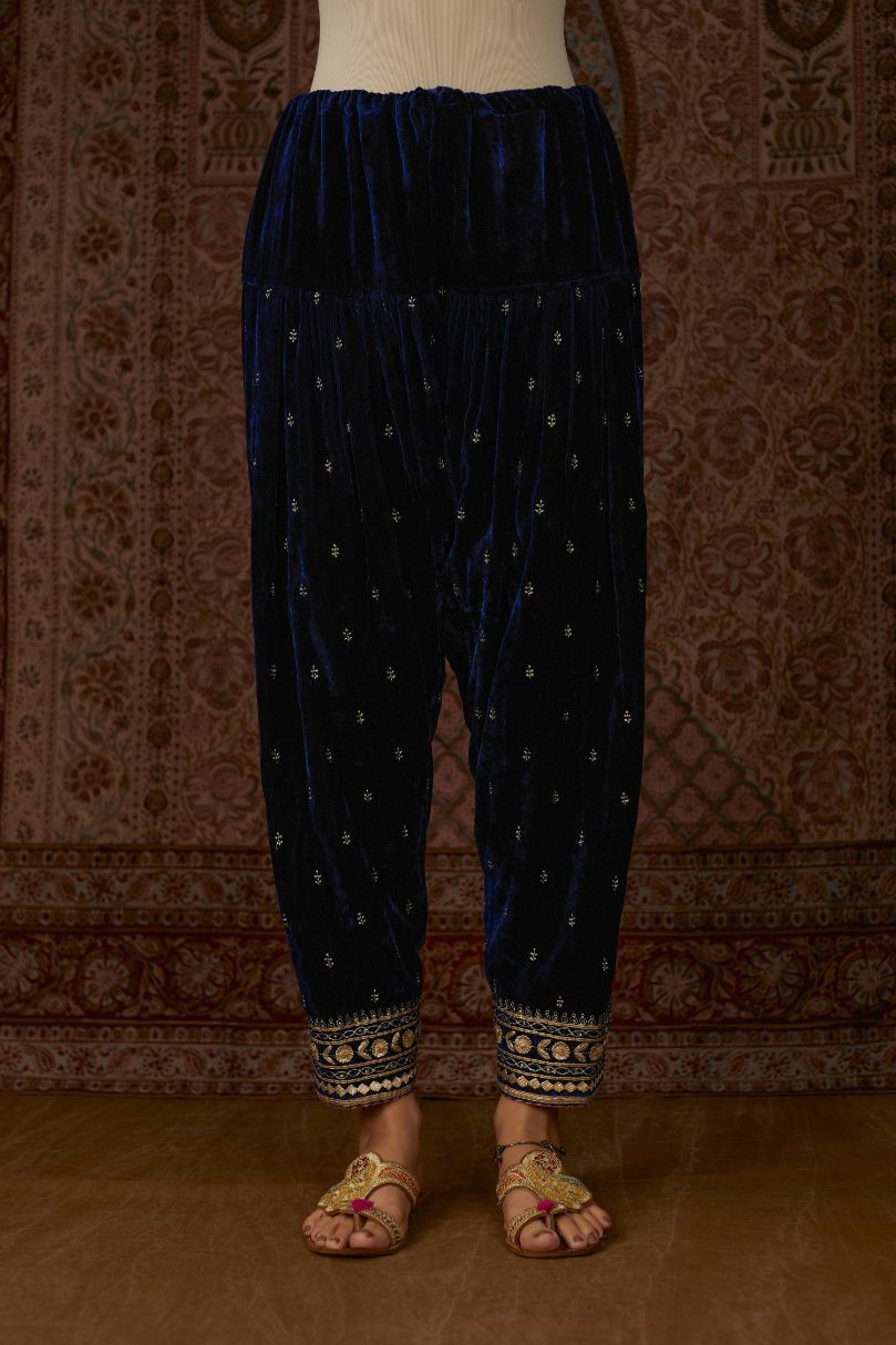 Navy silk velvet narrow salwar with gold gota and zari embroidery at the bottom and delicate butis all over (Salwar)