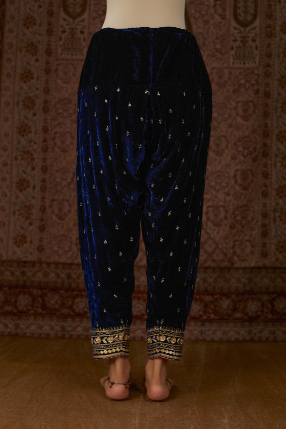Navy silk velvet narrow salwar with gold gota and zari embroidery at the bottom and delicate butis all over (Salwar)