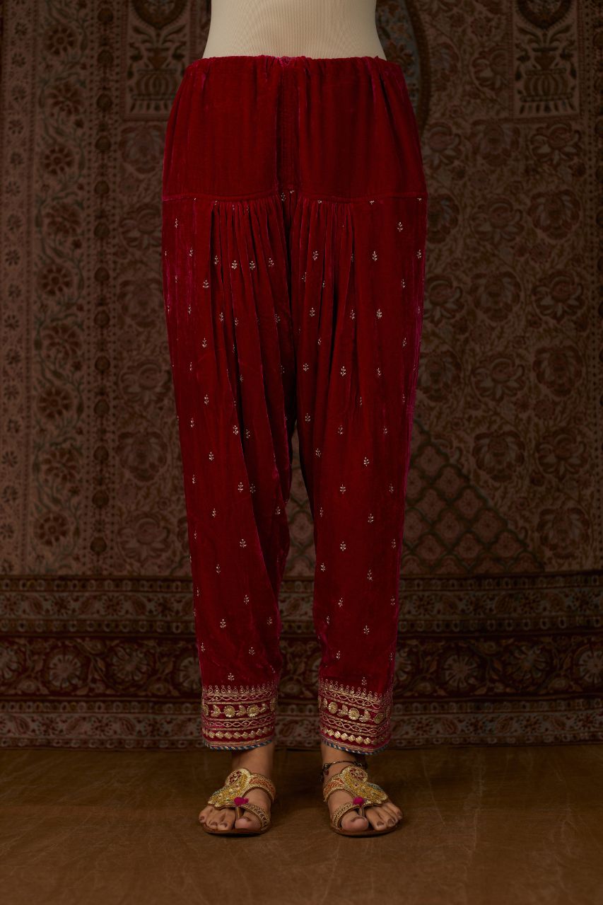 Fuchsia silk velvet narrow salwar with gold gota and zari embroidery at the bottom and delicate butis all over (Salwar)