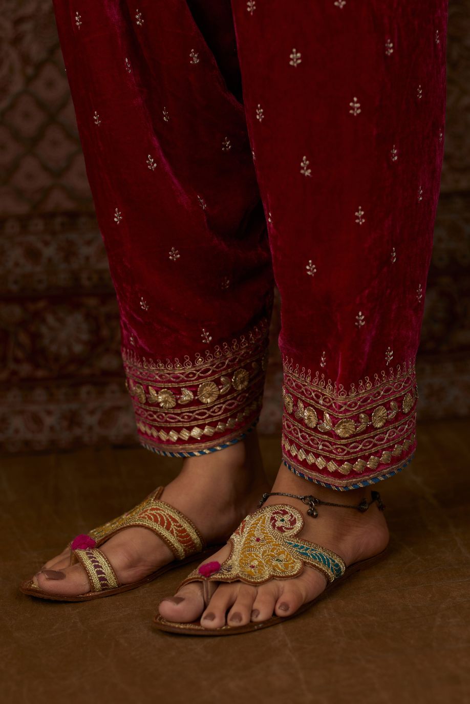 Fuchsia silk velvet narrow salwar with gold gota and zari embroidery at the bottom and delicate butis all over (Salwar)