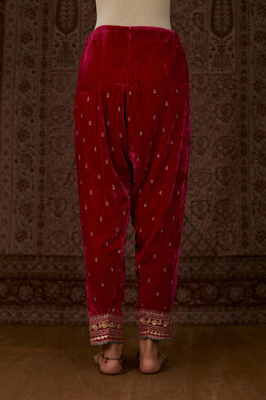 Fuchsia silk velvet narrow salwar with gold gota and zari embroidery at the bottom and delicate butis all over (Salwar)