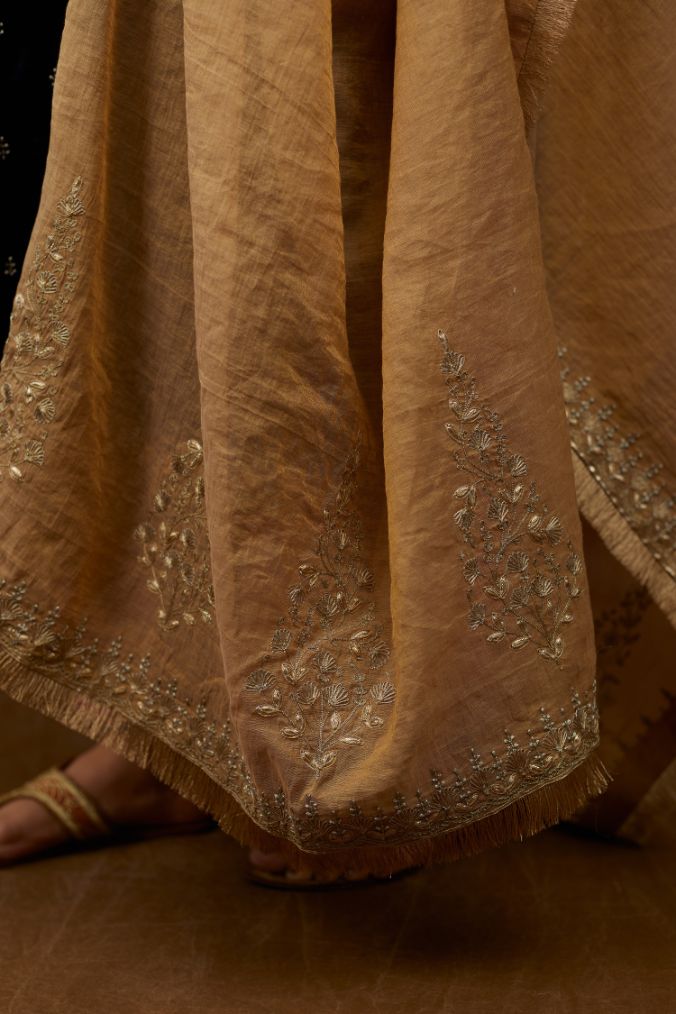 Tissue Chanderi dupatta with delicate gold zari and gota embroidery border running along all edges with large butas placed at the pallas, end pieces (Dupatta)