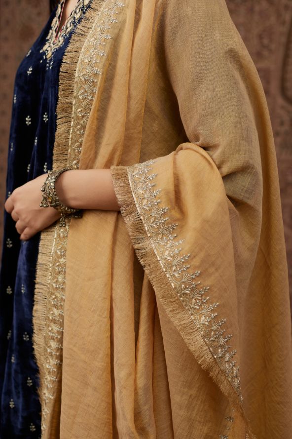 Tissue Chanderi dupatta with delicate gold zari and gota embroidery border running along all edges with large butas placed at the pallas, end pieces (Dupatta)
