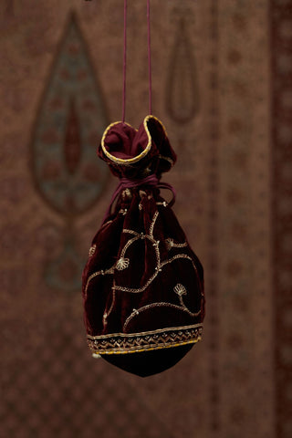 Silk Velvet potli with drawstrings and a shoulder string. It has gold gota and zari embroidery at the bottom and a delicate jaal all over (Potli)