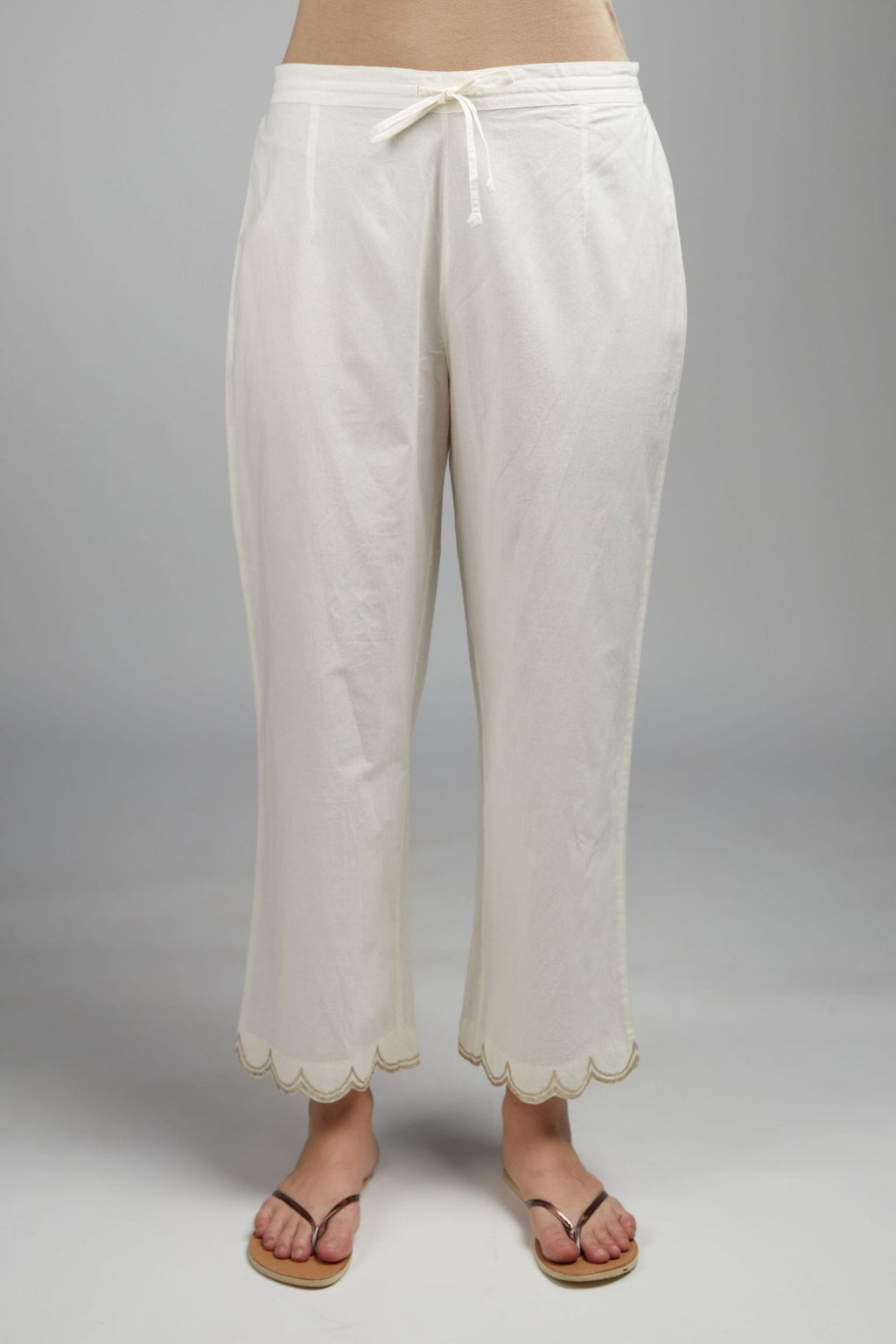Off white cotton straight pant with gota detailing at hem