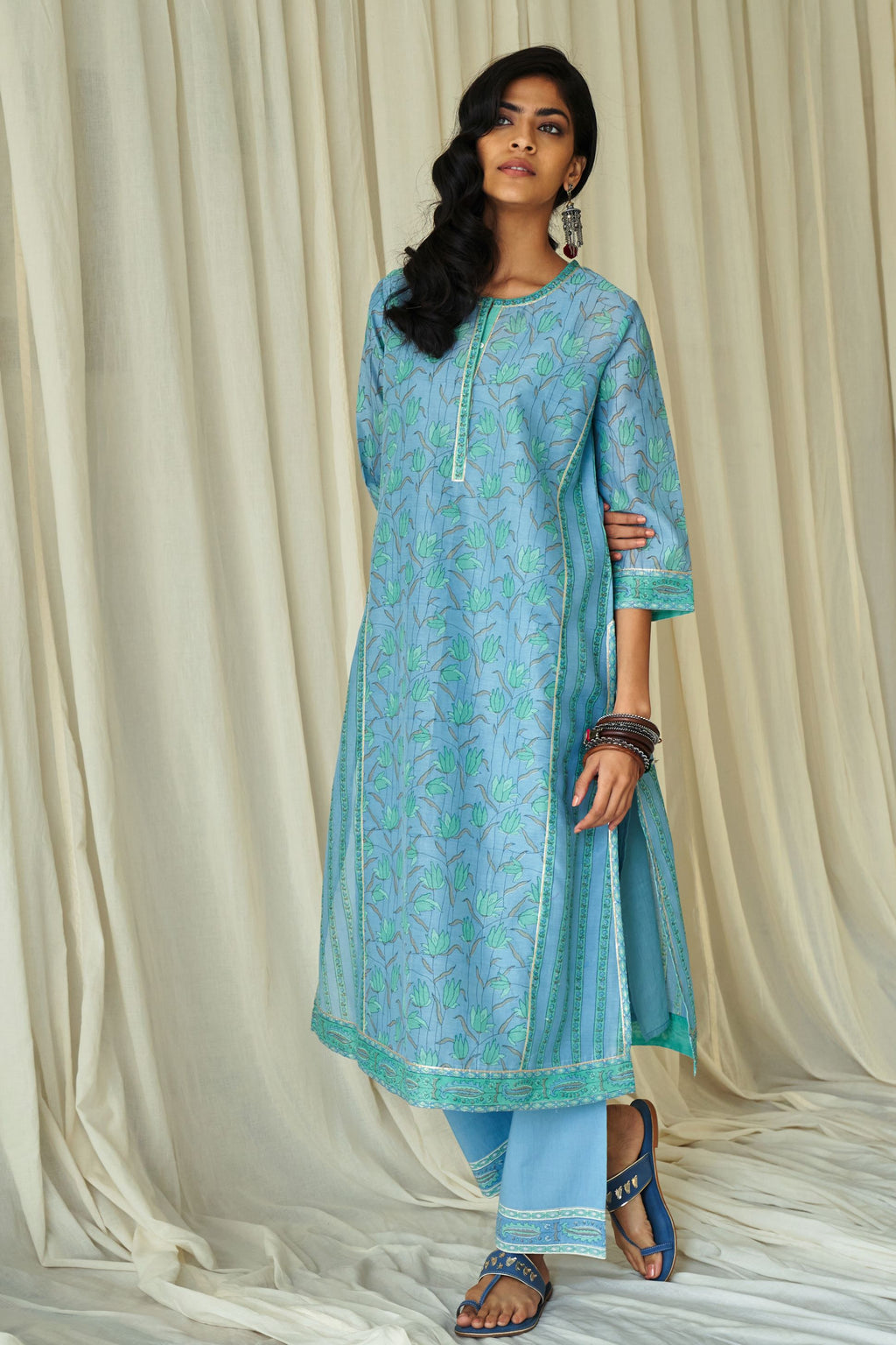 Blue straight kurta in assorted hand block prints with front placket and side panels.