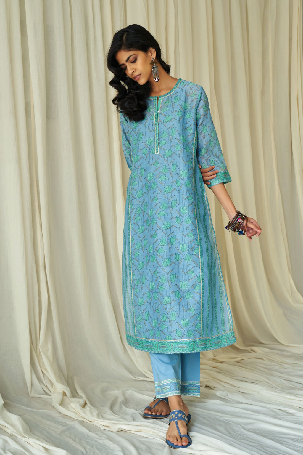 Blue straight kurta in assorted hand block prints with front placket and side panels.