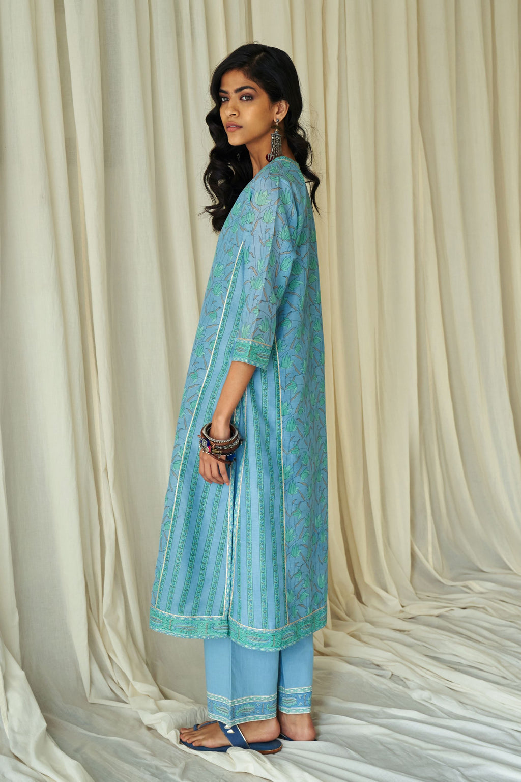 Blue straight kurta in assorted hand block prints with front placket and side panels.