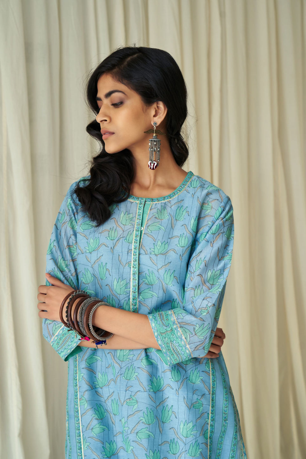 Blue straight kurta in assorted hand block prints with front placket and side panels.