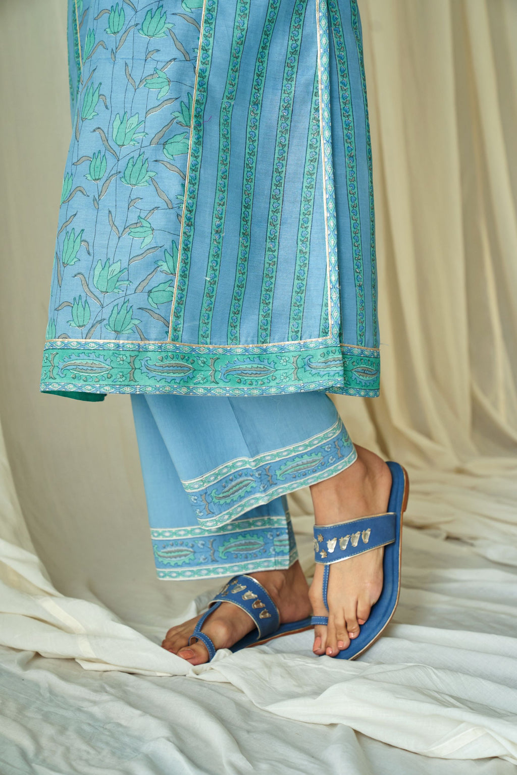 Blue straight kurta in assorted hand block prints with front placket and side panels.