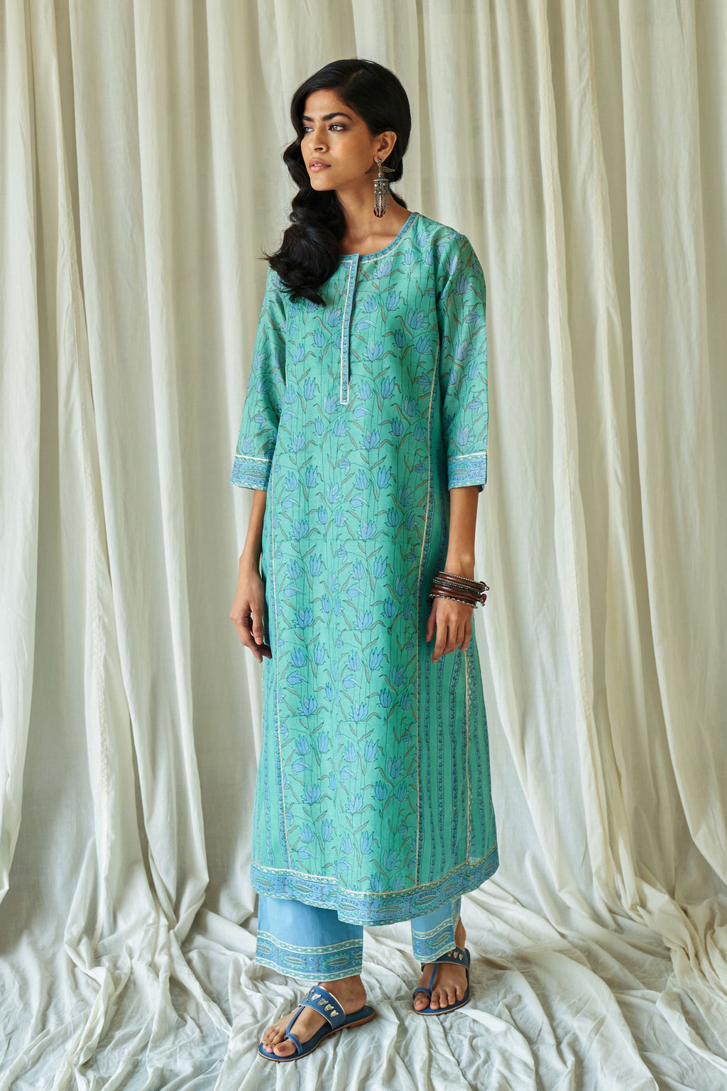 Persian straight kurta in assorted hand block prints with front placket and side panels.