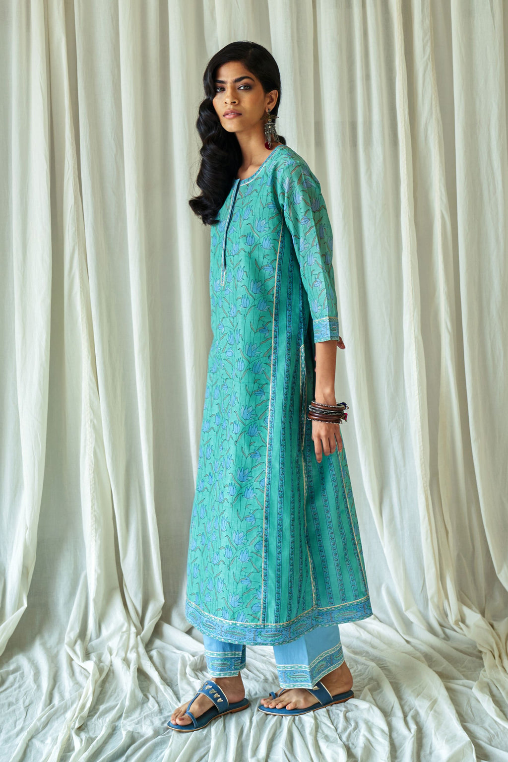 Persian straight kurta in assorted hand block prints with front placket and side panels.