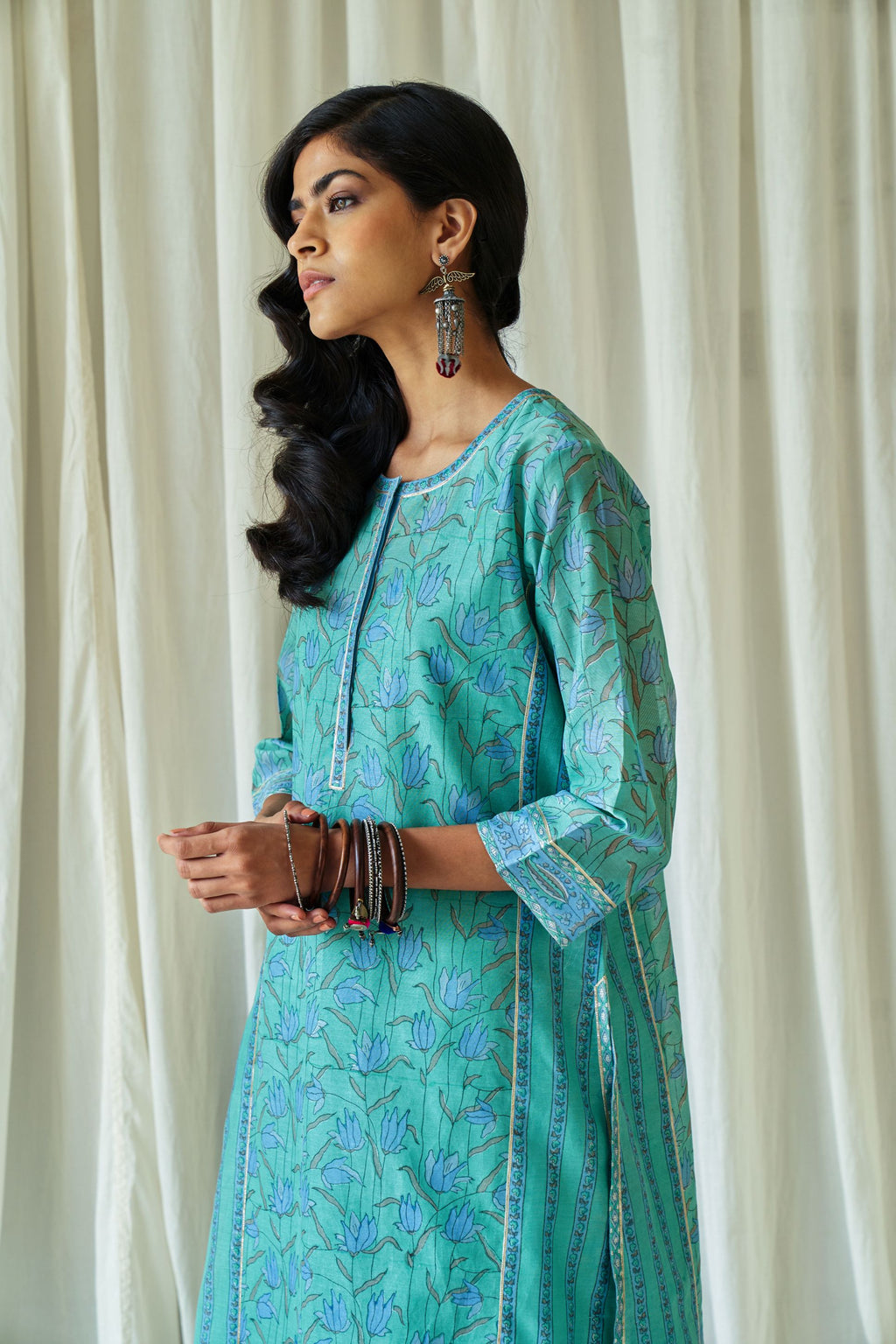 Persian straight kurta in assorted hand block prints with front placket and side panels.