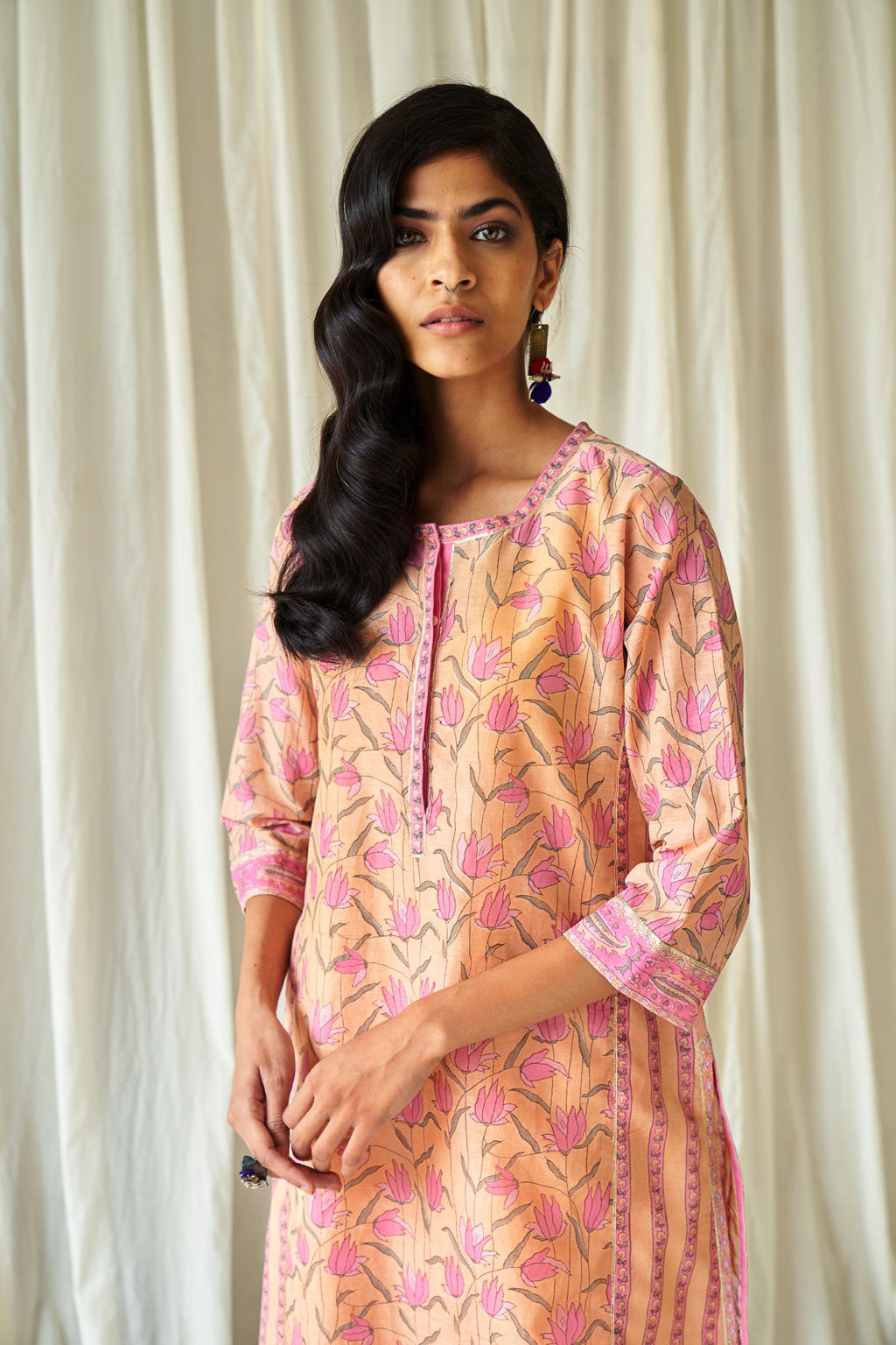 Peach straight kurta in assorted hand block prints with front placket and side panels.