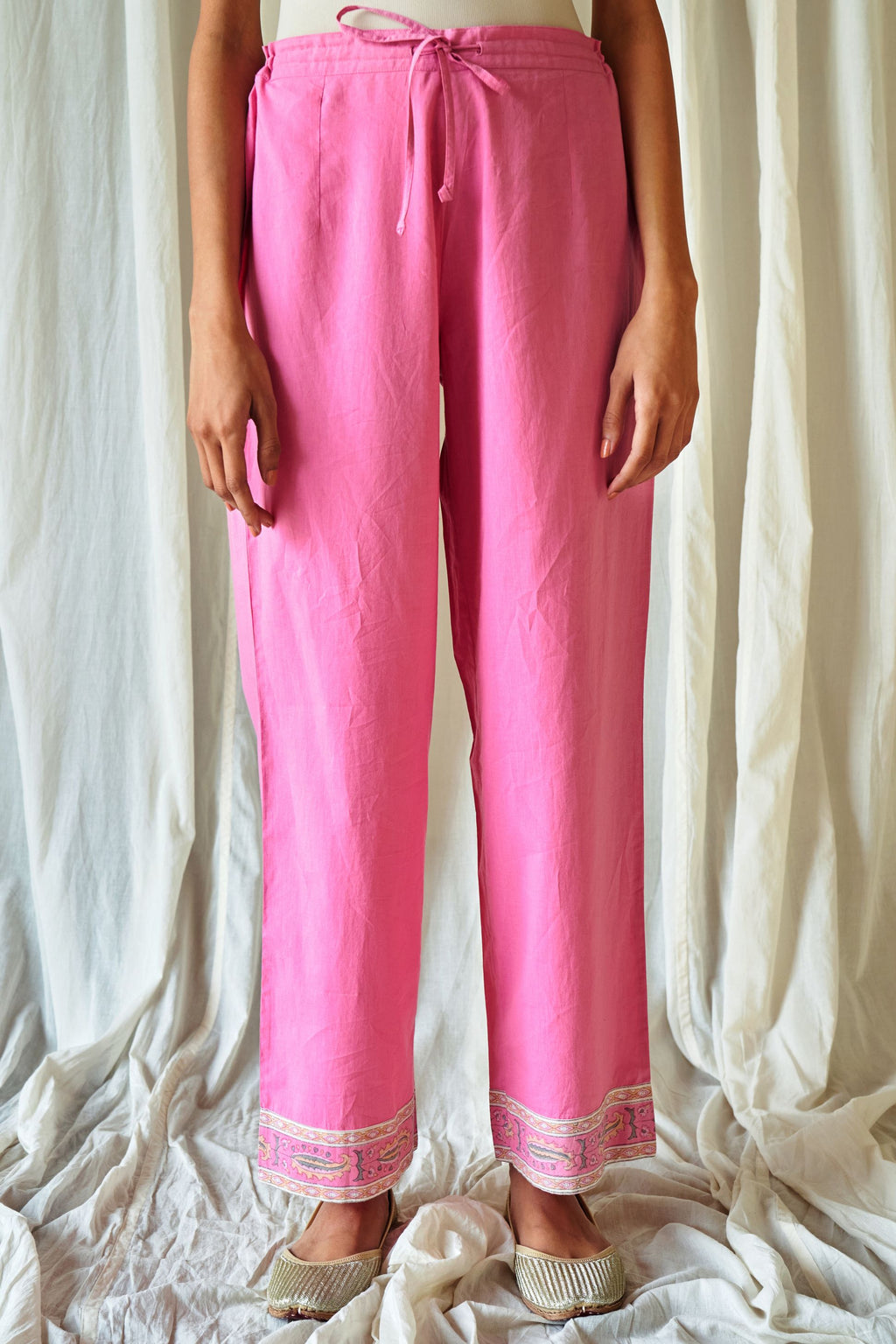 Pink straight cotton pants with hand block print at hem