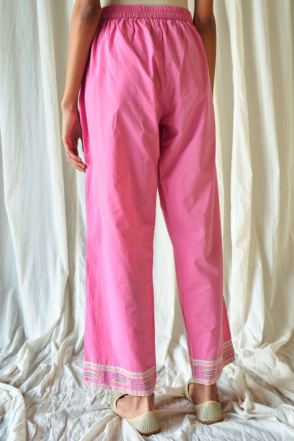 Pink straight cotton pants with hand block print at hem