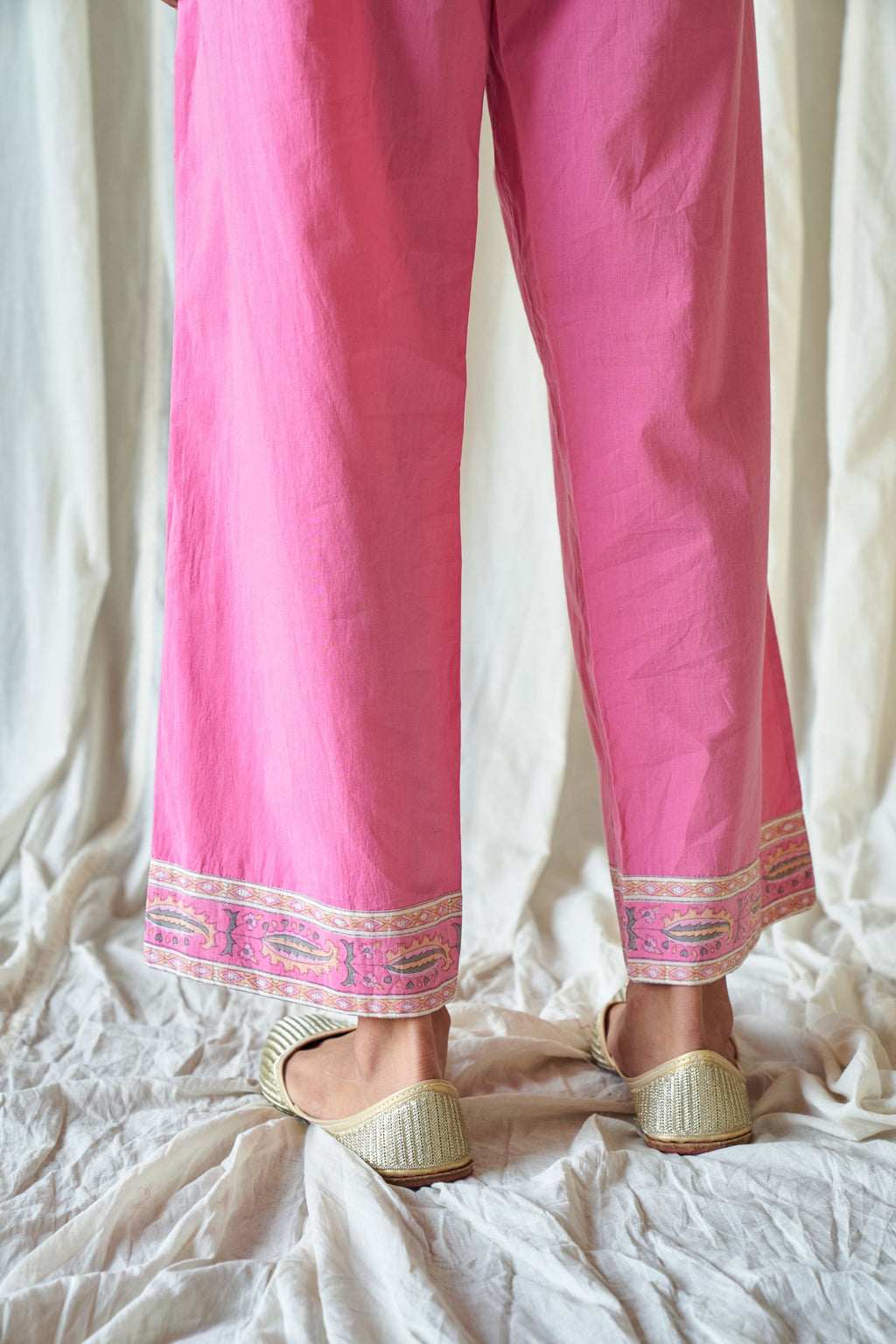 Pink straight cotton pants with hand block print at hem