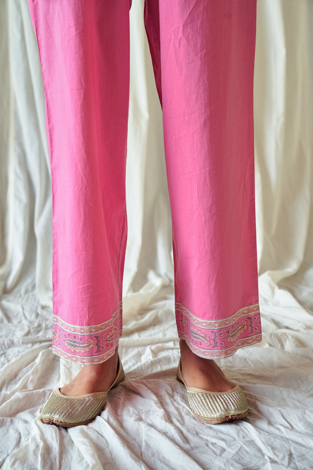 Pink straight cotton pants with hand block print at hem