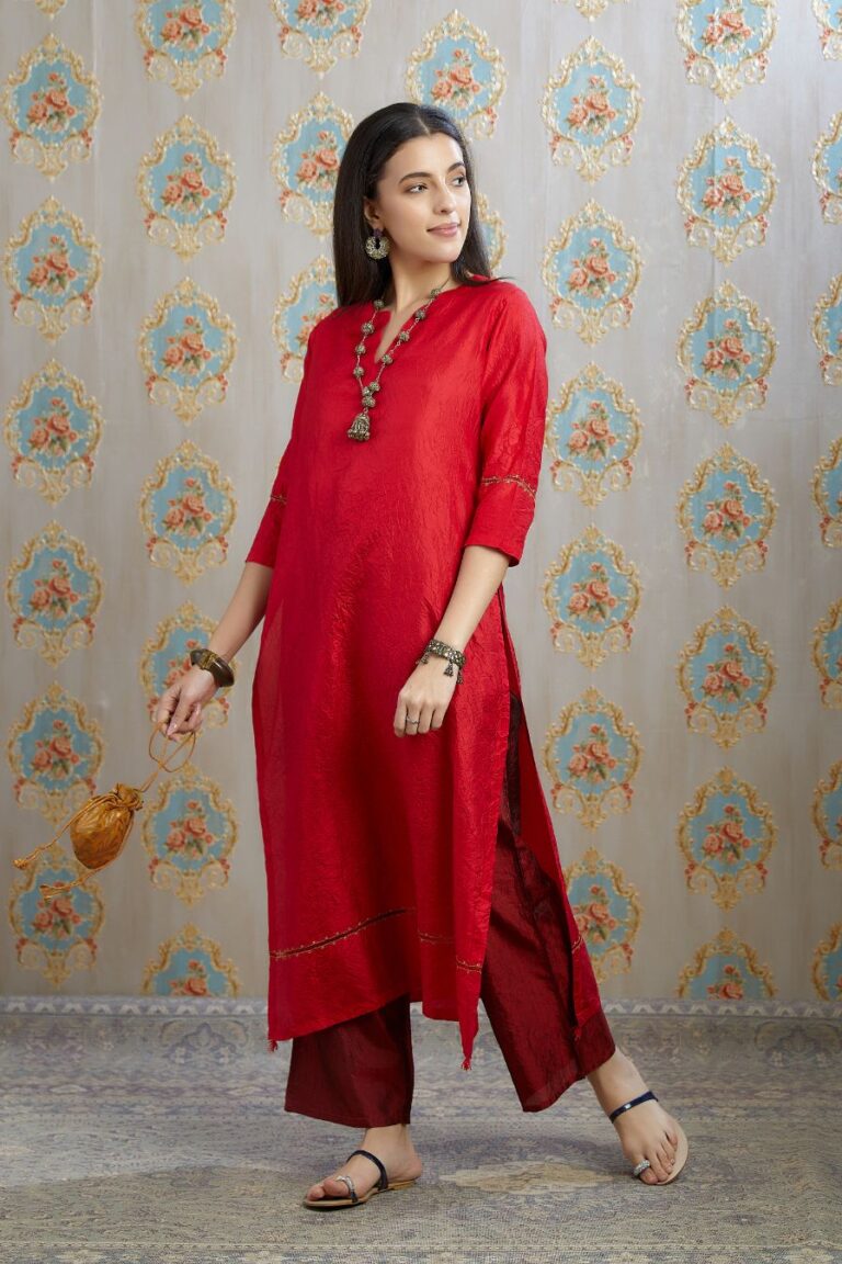 Red hand crushed silk kurta with pulled thread embroidery, paired with hand crushed silk pants.