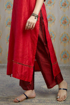 Red hand crushed silk kurta with pulled thread embroidery, paired with hand crushed silk pants.