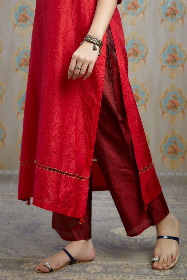 Red hand crushed silk kurta with pulled thread embroidery, paired with hand crushed silk pants.