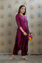 Wine hand crushed silk kurta with pulled thread embroidery, paired with hand crushed straight silk pants