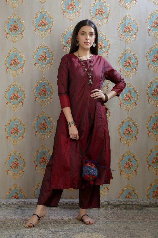 Maroon hand crushed silk kurta with contrasting side panels, paired with hand crushed straight silk pants.