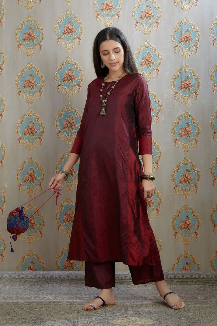 Maroon hand crushed silk kurta with contrasting side panels, paired with hand crushed straight silk pants.