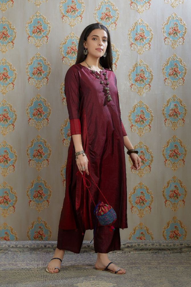 Maroon hand crushed silk kurta with contrasting side panels, paired with hand crushed straight silk pants.