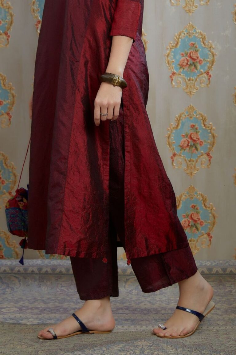 Maroon hand crushed silk kurta with contrasting side panels, paired with hand crushed straight silk pants.