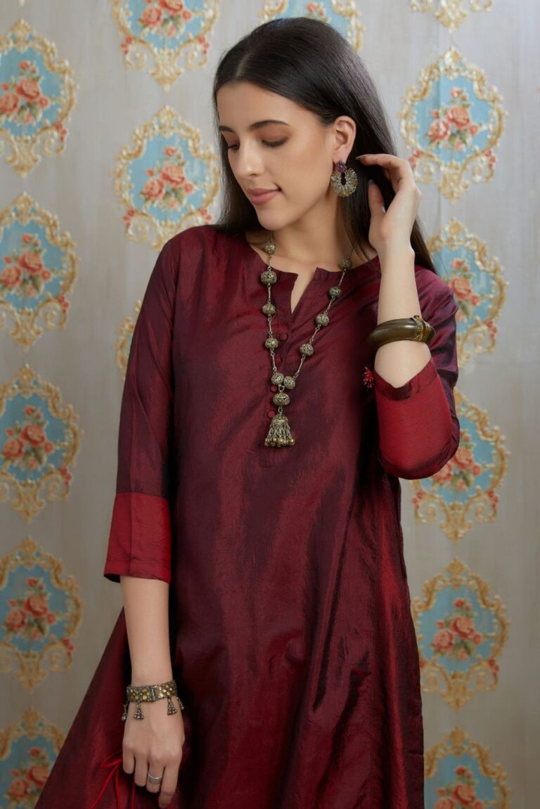 Maroon hand crushed silk kurta with contrasting side panels, paired with hand crushed straight silk pants.