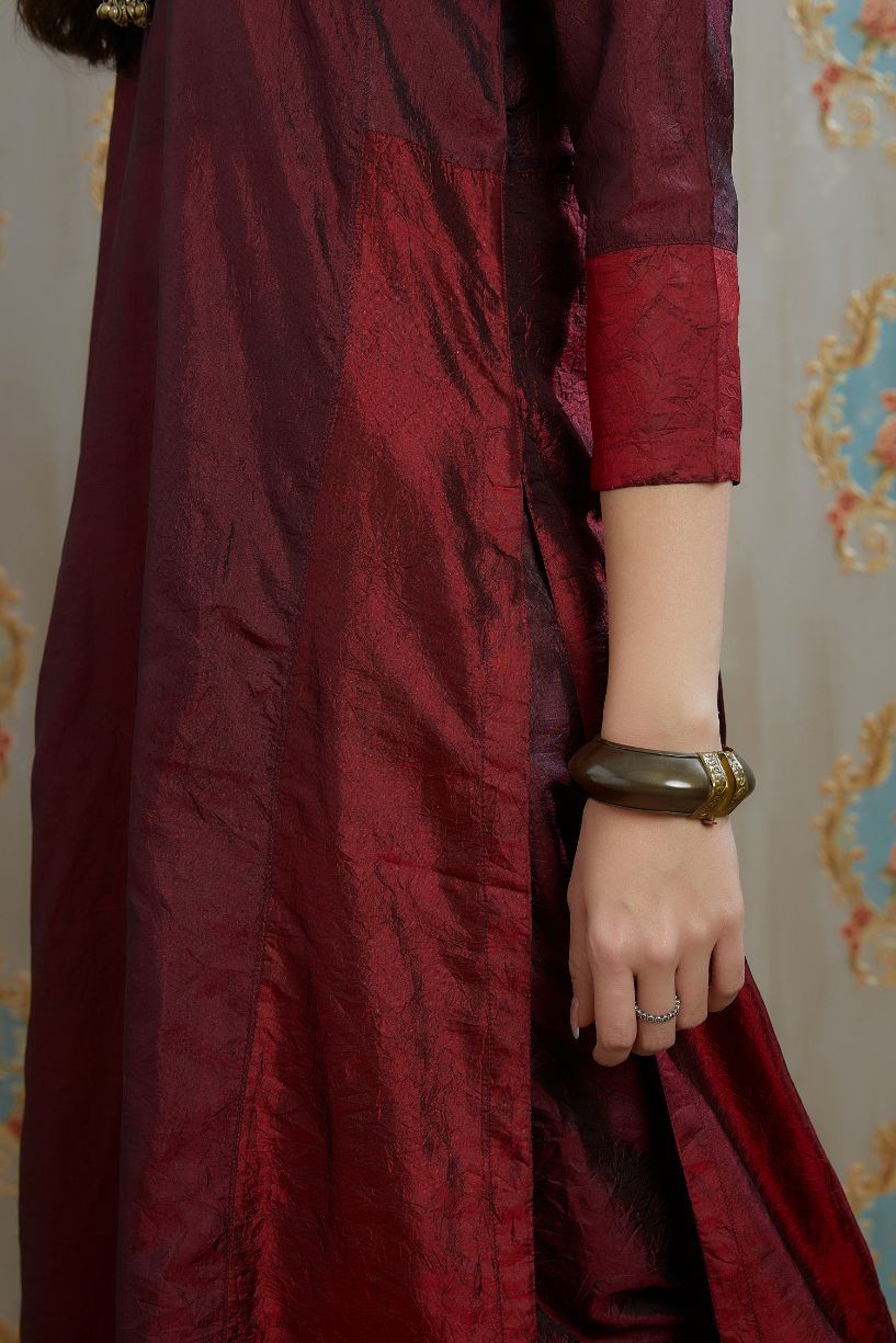 Maroon hand crushed silk kurta with contrasting side panels, paired with hand crushed straight silk pants.