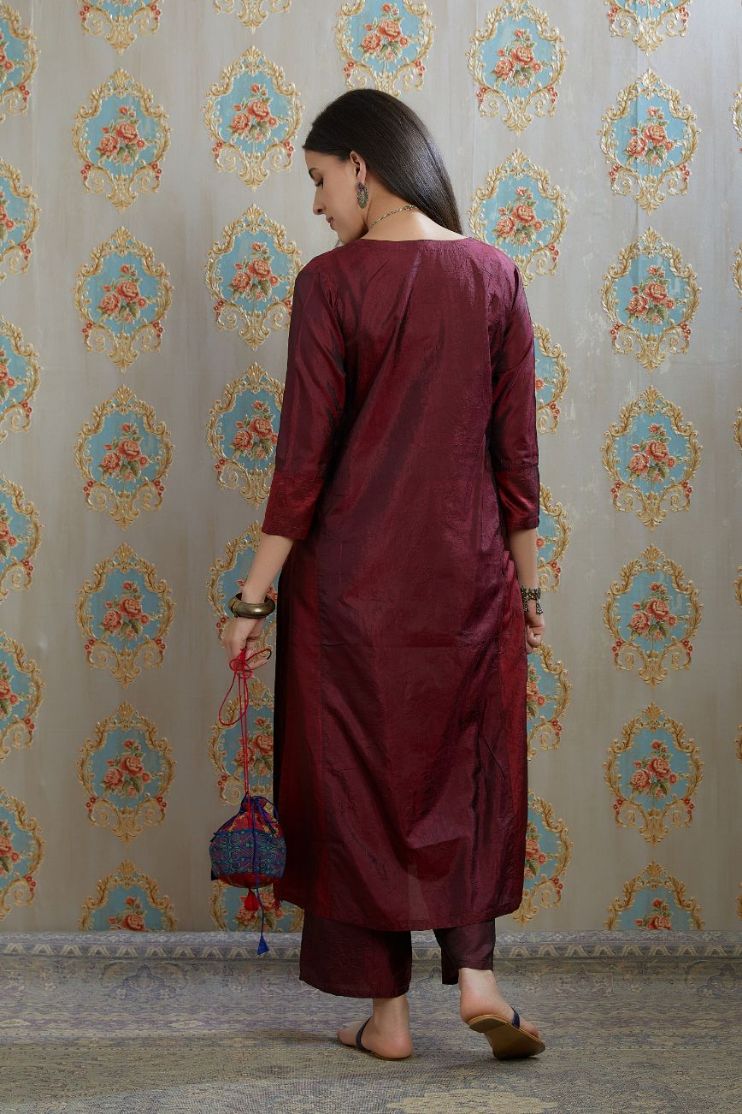 Maroon hand crushed silk kurta with contrasting side panels, paired with hand crushed straight silk pants.