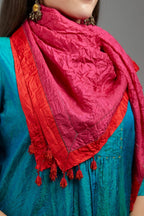 Hand crushed fuchsia silk scarf with contrasting red silk fabric at edges joint with gold zari faggoting