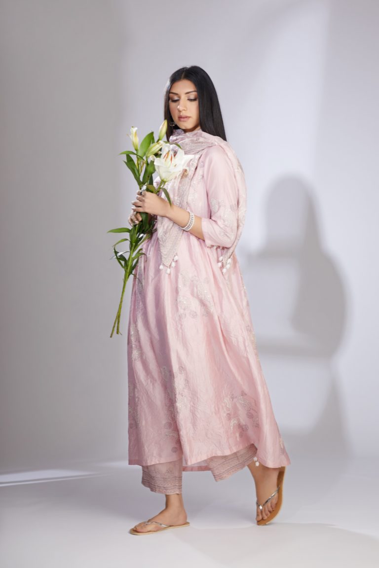 Pink hand-crushed silk kurta set with wavy empire waistline and gathers, highlighted with delicate sequins embroidery