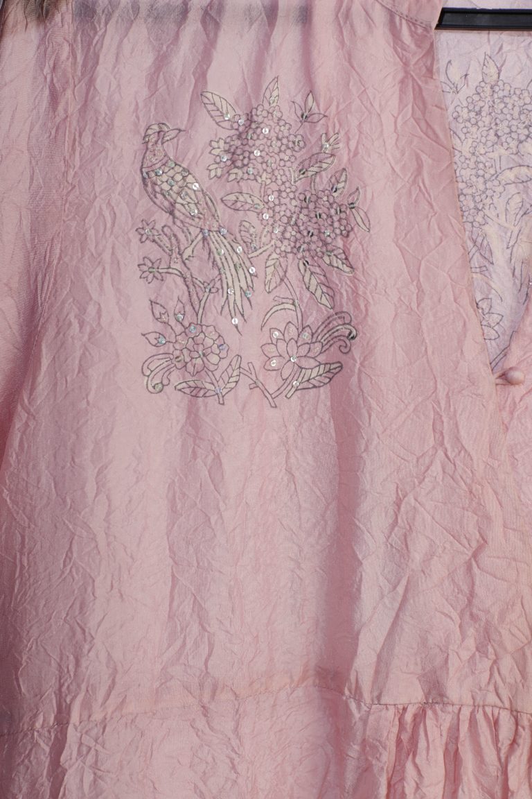 Pink hand-crushed silk kurta set with wavy empire waistline and gathers, highlighted with delicate sequins embroidery