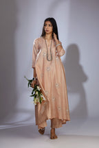 Peach silk hand-crushed asymmetric hem kurta set with block prints embellished with sequins